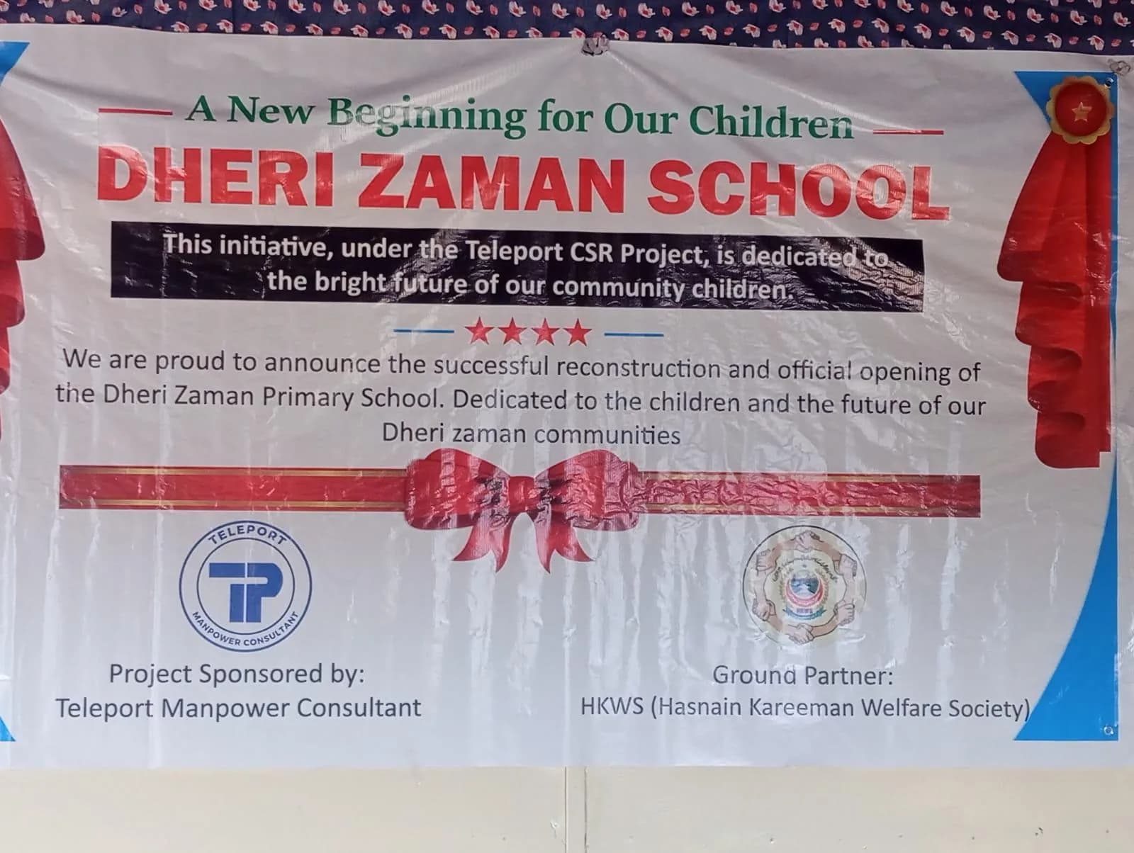 Students and teachers outside the rebuilt Dheri Zaman Primary School