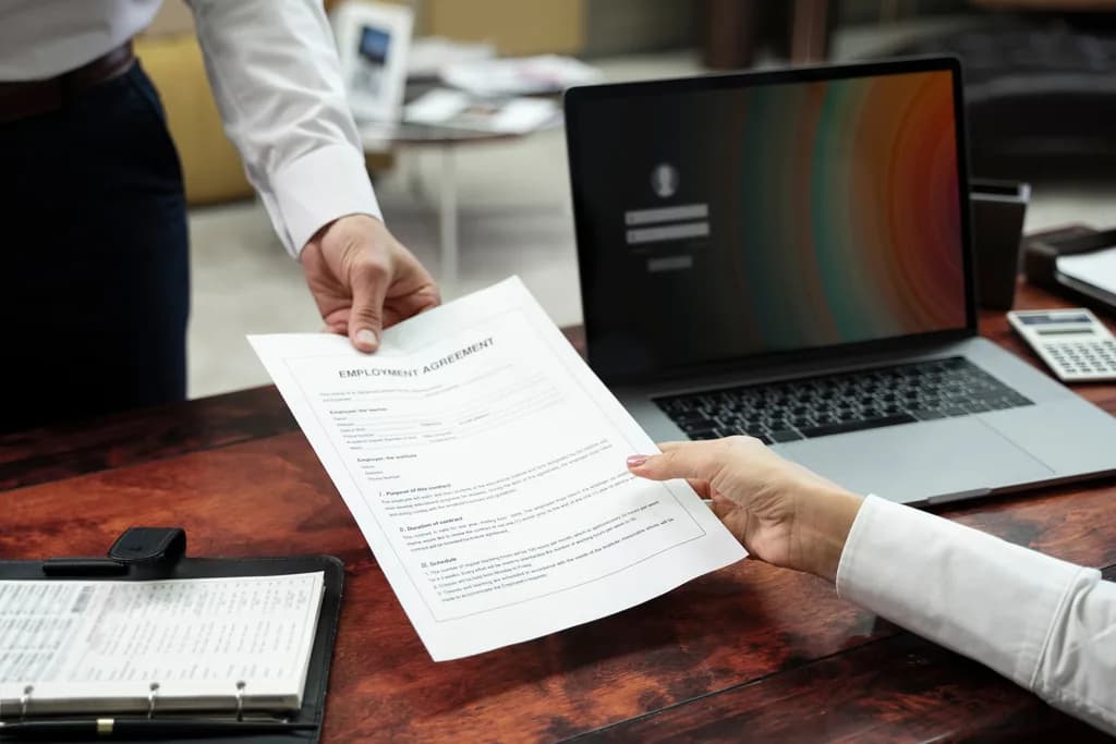 Teleport Manpower team reviewing legal documentation
