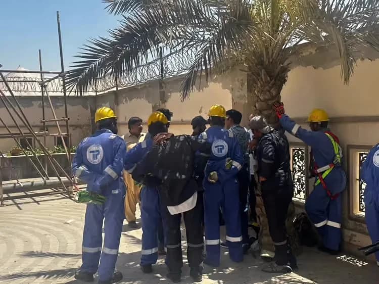 Construction workers gathered for an on-site manpower assessment