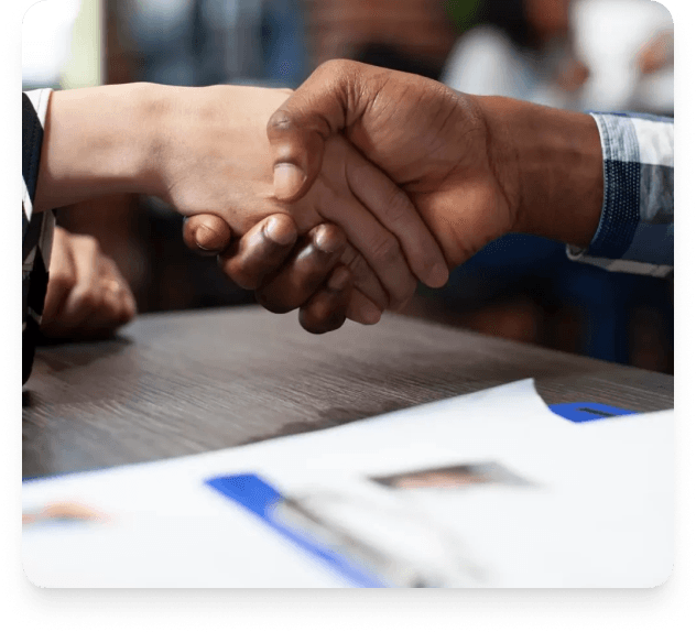 Business partners shaking hands after a recruitment discussion